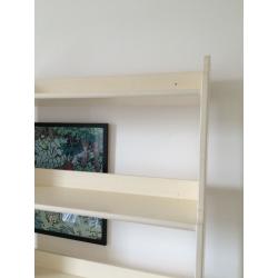 Tall wooden Ikea bookshelves. Painted in white eggshell.