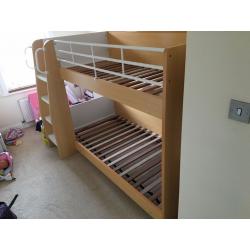 Bunk bed in wood with shelves