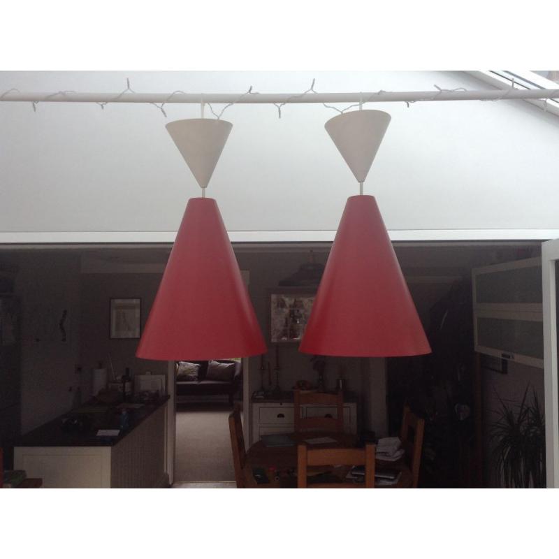 Pair of matching red Ikea metal light shades.