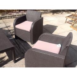 Rattan brown furniture with cream cusions