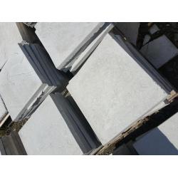 Light grey 450x450x38mm Riven concrete paving slabs.