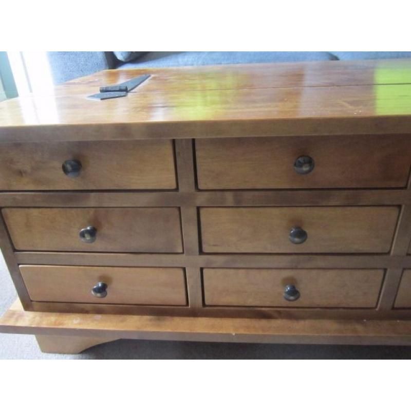 Laura Ashley wooden coffee table with 12 draws and opens for storage