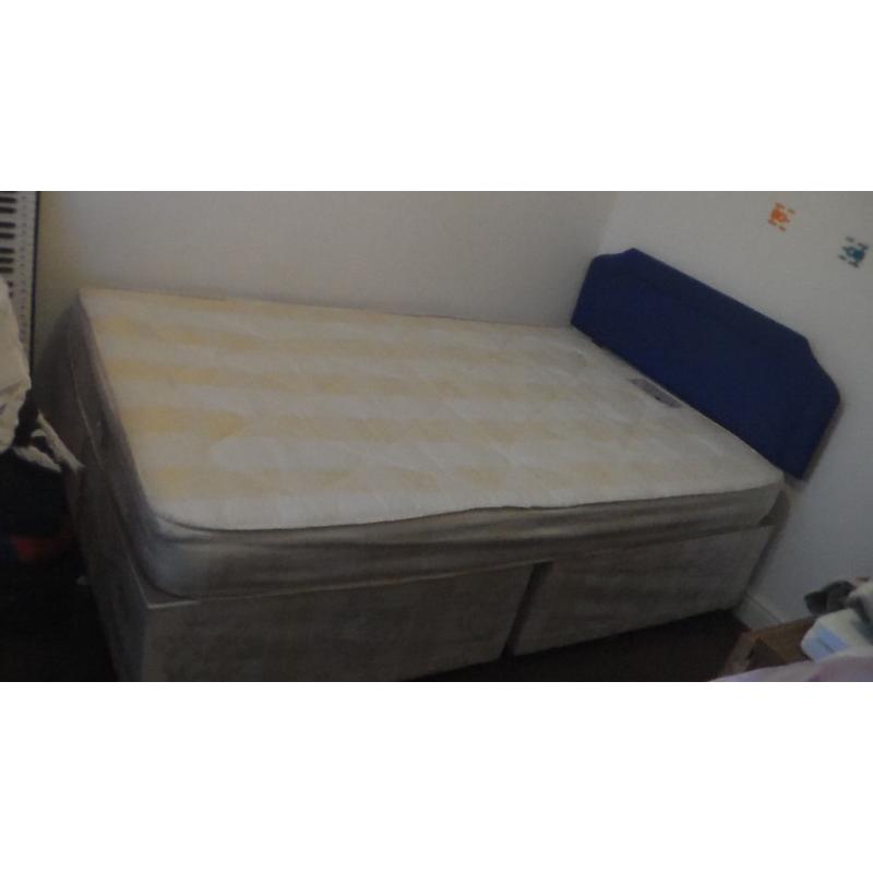 Small double bed with mattress and headboard
