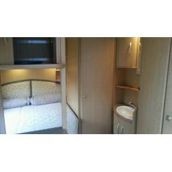 Small abbey vogue fixed bed caravan