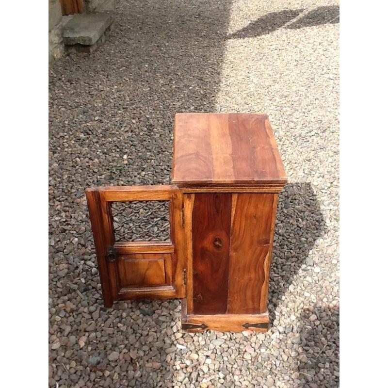 Small Wooden cabinet with metal grill on door