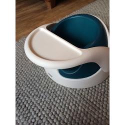 Mamas and Papas Snug Seat / Bumbo in white and teal.