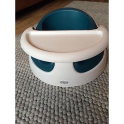 Mamas and Papas Snug Seat / Bumbo in white and teal.