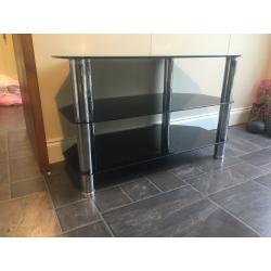 Glass unit . Black stereo or tv unit. Corner or flat wall