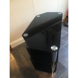 Glass unit . Black stereo or tv unit. Corner or flat wall