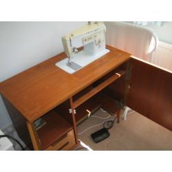 singer sewing machine in wooden cabinet
