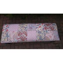 Large footstool with vintage fabric