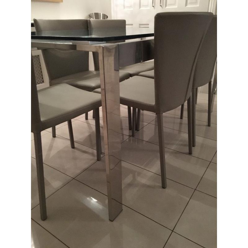 Modern 6 seater glass and steel dining table