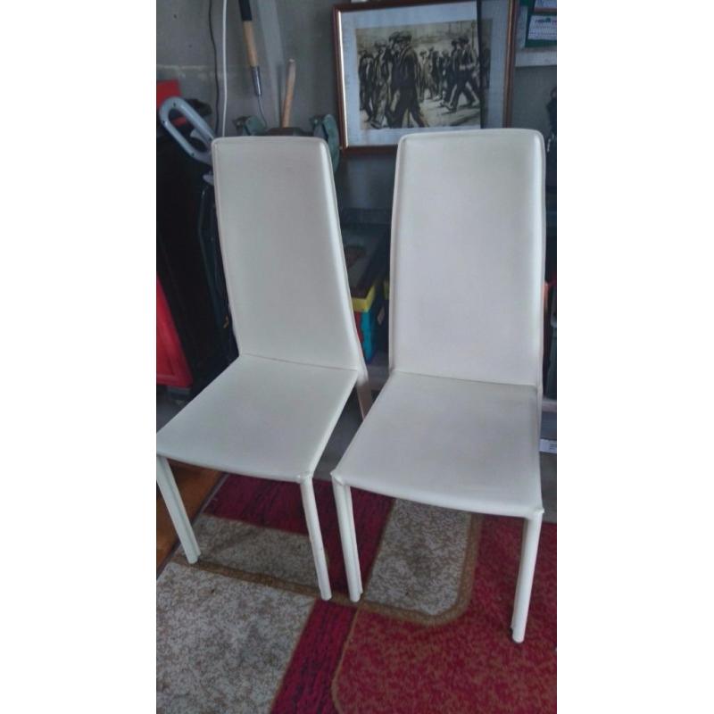 2 cream leather chairs