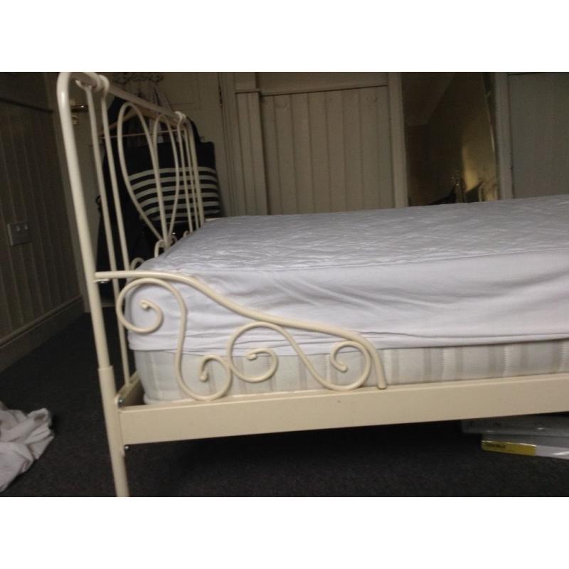 Cream, metal framed single bed with mattress from a non smoking household.