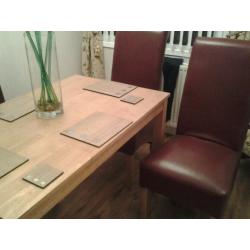 Table solid wood and 4 faux leather chairs.