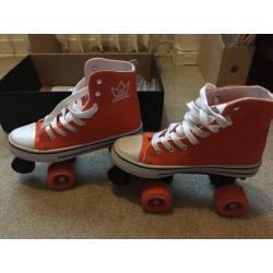 Orange converse roller skates