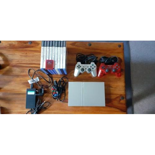 PS2 Slim Silver with 2 Official Controllers, 1 Official Memory Card + Games